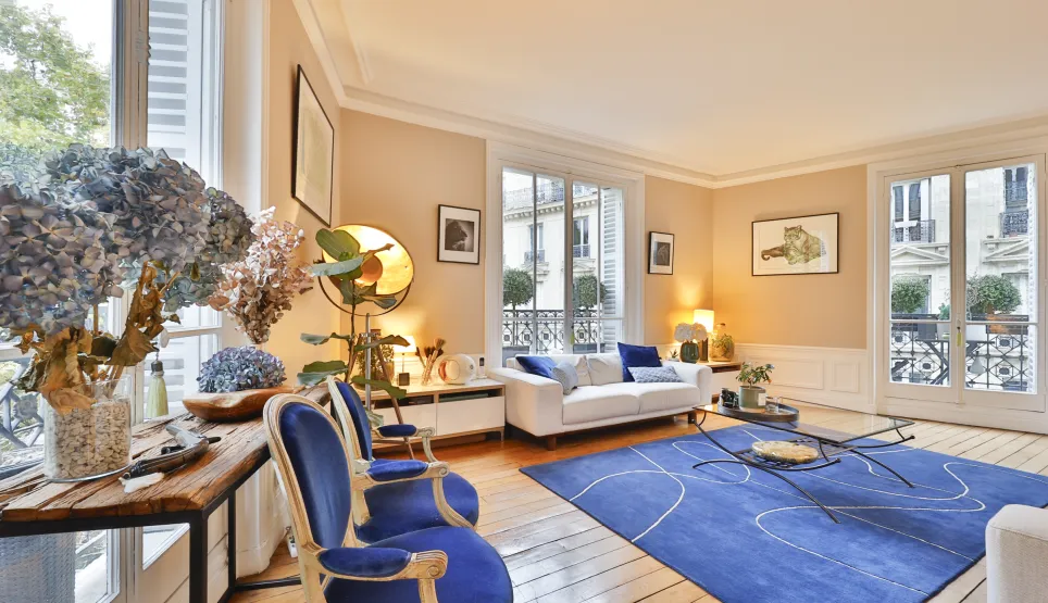 Luxury Parisian living room: bright, elegant, contemporary design with blue accents. Perfect for an exceptional apartment.