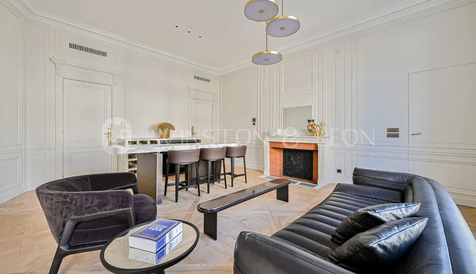 Luxury Parisian living room, contemporary & classic design fusion. Elegant apartment with bar, fireplace, moldings, parquet, and high-end furniture.