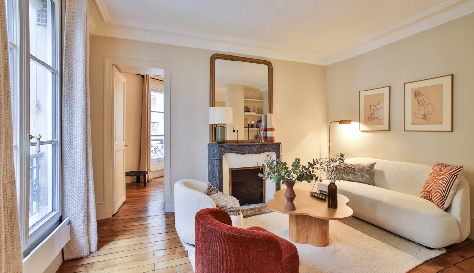 Luxury Parisian living room, modern and elegant design with fireplace, hardwood floor, natural light. Ideal for a high-end apartment.