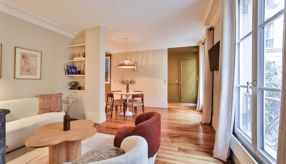 Luxury Parisian apartment: bright living-dining room, modern and elegant design, hardwood floors, contemporary furniture. Perfect for refined living.