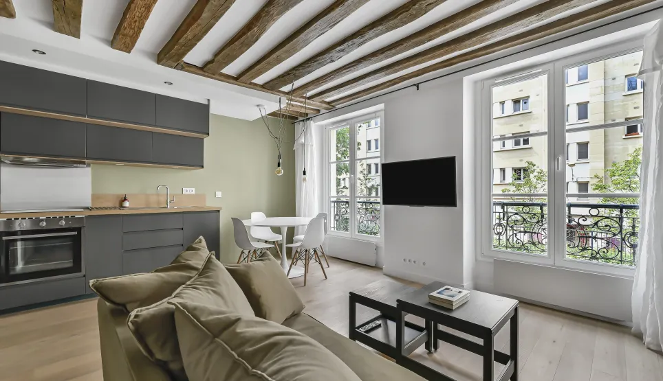 Luxury renovated apartment, open-plan living-kitchen, exposed beams, modern design, bright. Ideal Paris investment.