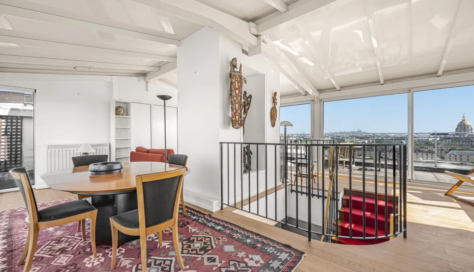 Luxury penthouse with panoramic Paris view, bright living space & modern design. Duplex with elegant staircase.