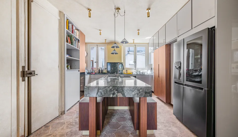 Modern luxury kitchen featuring a stunning marble island, high-end appliances, and elegant design. Perfect for a Parisian apartment.