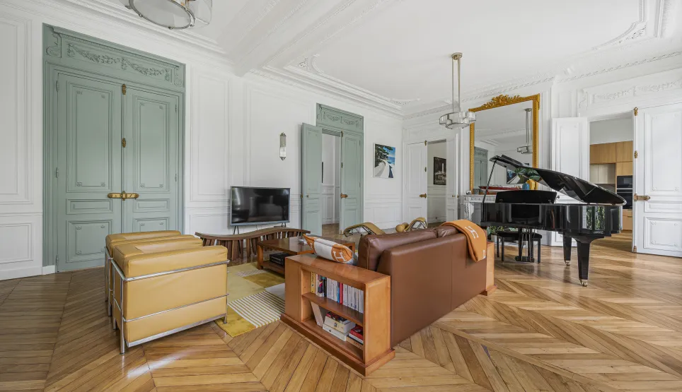 Luxury Parisian living room, herringbone parquet, moldings, grand piano. Elegant and refined design for a Haussmannian apartment.