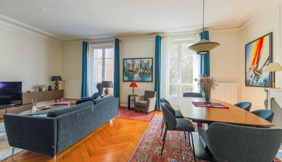 Spacious, bright luxury apartment. Elegant living-dining room with parquet, large windows & contemporary design. Perfect for a chic Parisian lifestyle.