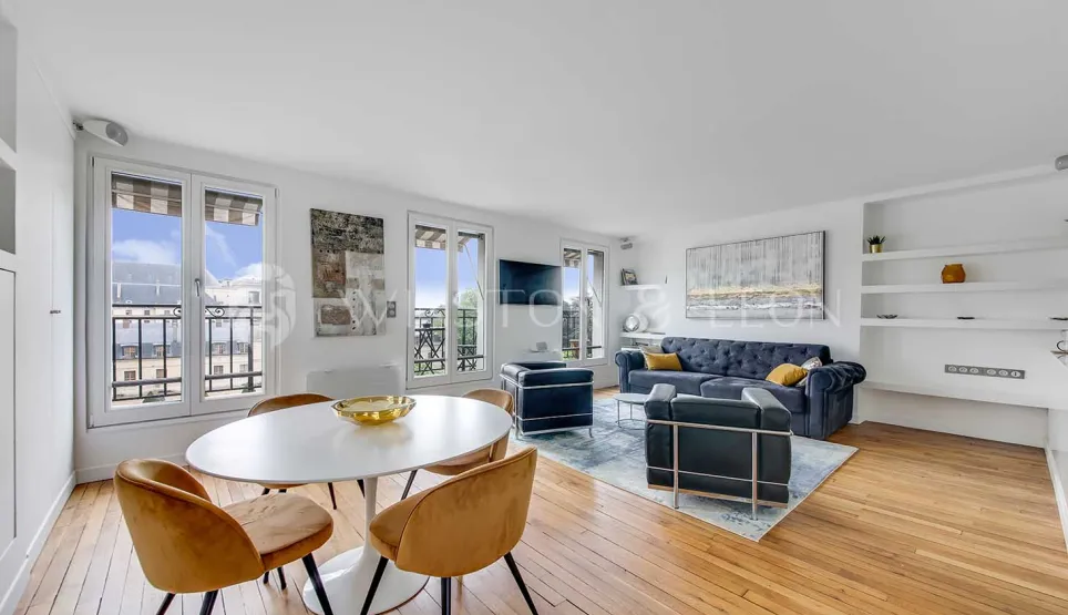 Bright luxury apartment featuring modern living/dining, hardwood floors, large windows with city views. Elegant and contemporary design.