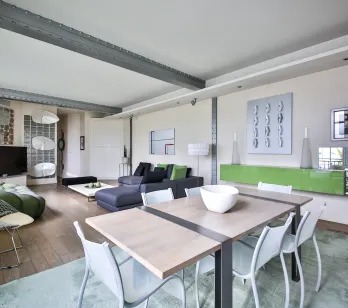Stunning luxury loft, contemporary design. Bright living-dining area, elegant furniture, industrial beams. Modern and spacious living space.