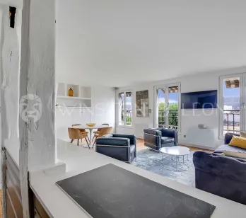 Modern luxury apartment. Bright open-plan living/dining area with city views, balconies. Elegant contemporary design.