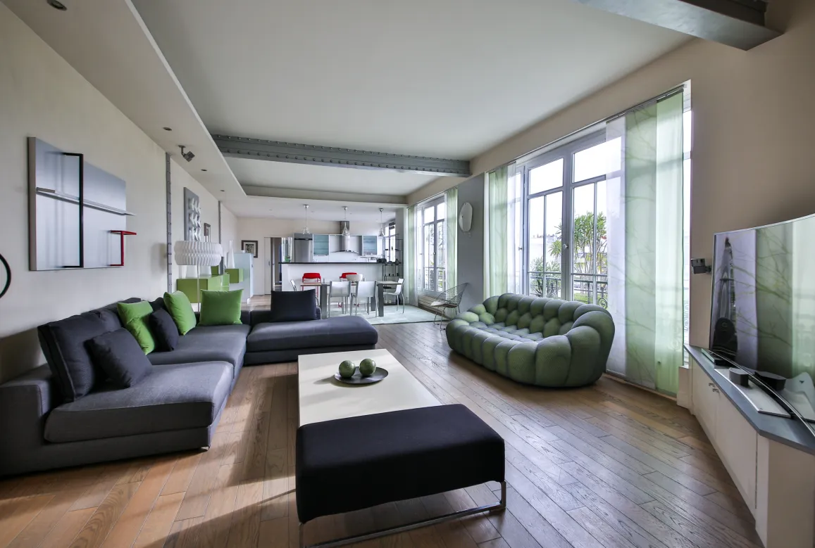 Spacious, bright luxury living room with contemporary design, open kitchen, and clear views. Perfect for a high-end apartment.