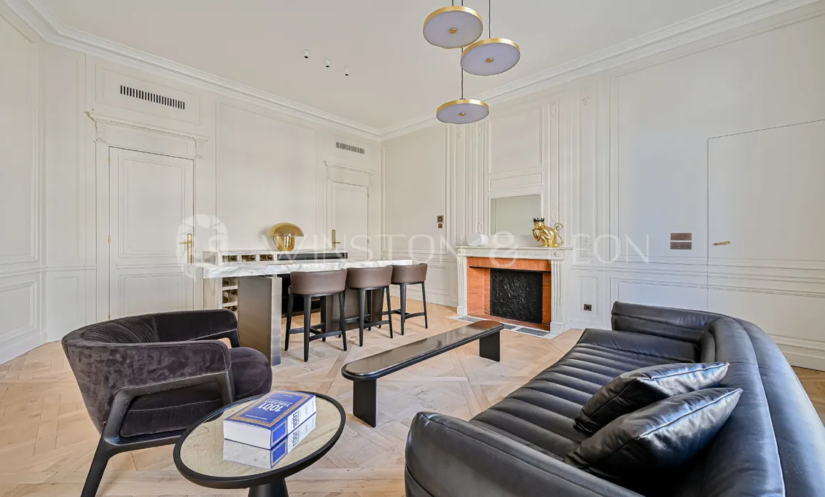 Luxury Parisian living room, contemporary & classic design fusion. Elegant apartment with bar, fireplace, moldings, parquet, and high-end furniture.