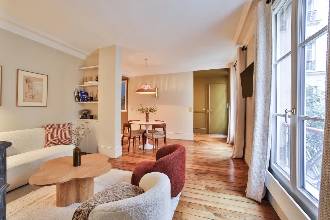 Luxury Parisian apartment: bright living-dining room, modern and elegant design, hardwood floors, contemporary furniture. Perfect for refined living.