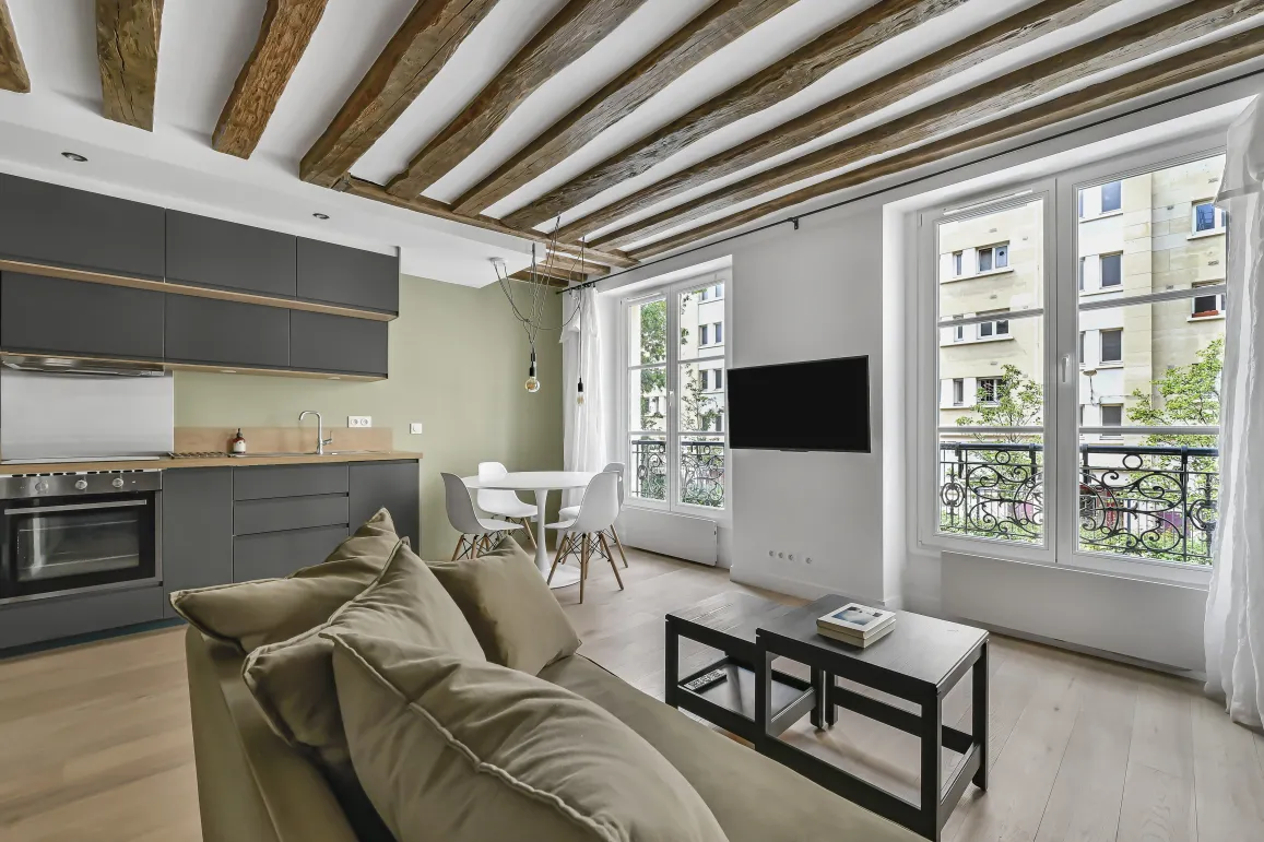 Luxury renovated apartment, open-plan living-kitchen, exposed beams, modern design, bright. Ideal Paris investment.