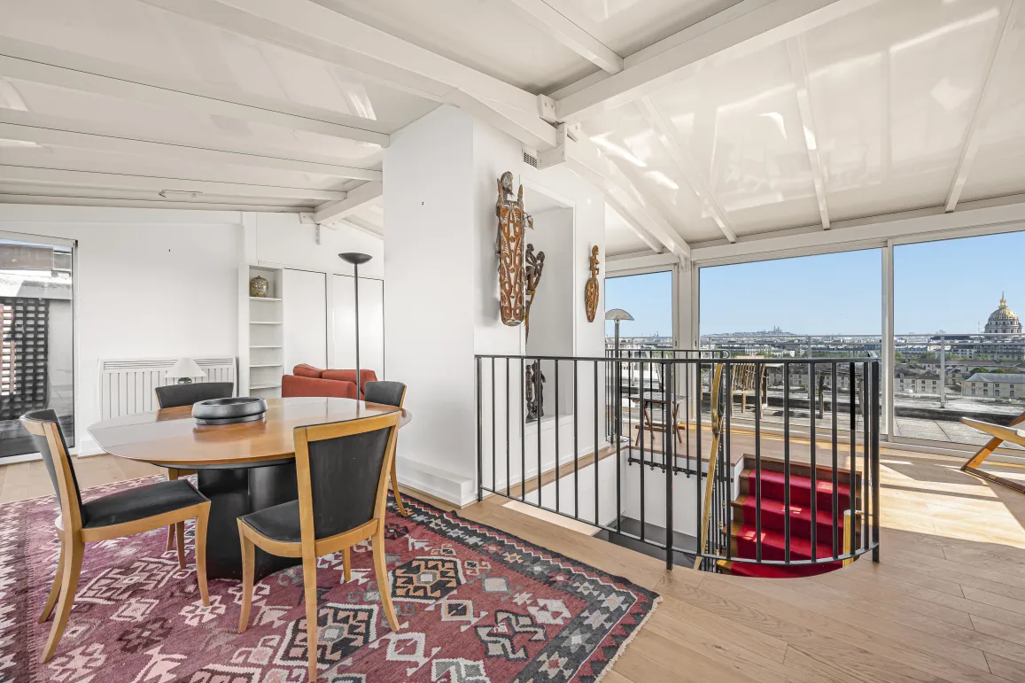Luxury penthouse with panoramic Paris view, bright living space & modern design. Duplex with elegant staircase.