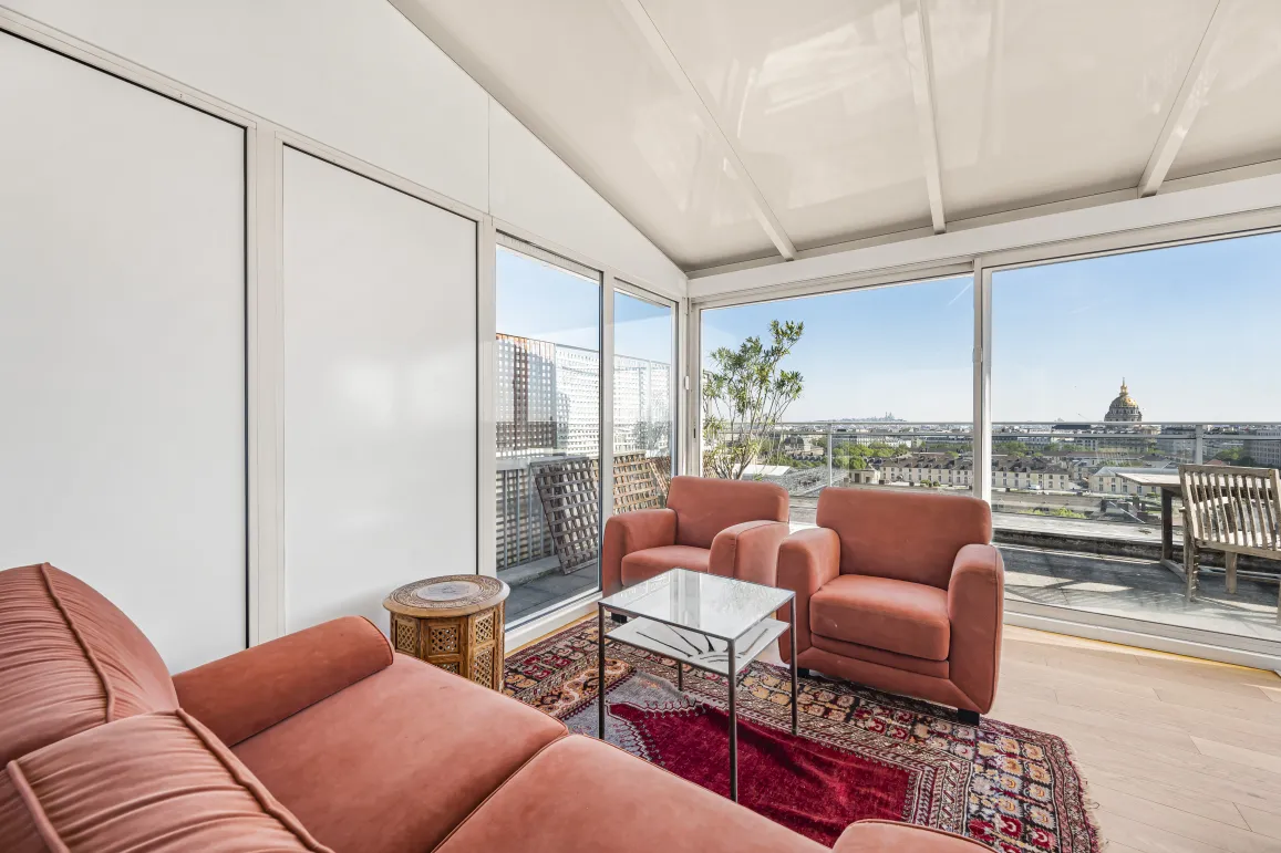 Luxury penthouse in Paris with panoramic Invalides view and sunny terrace. Elegant and bright living room.