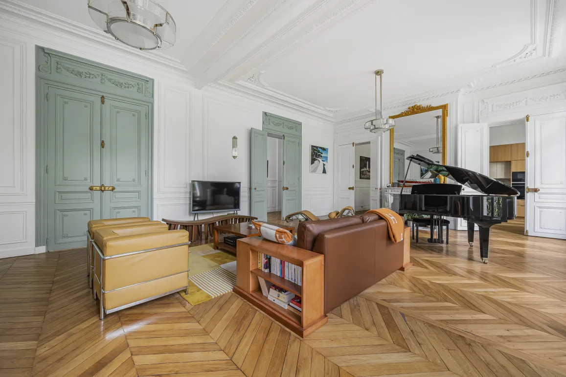 Luxury Parisian living room, herringbone parquet, moldings, grand piano. Elegant and refined design for a Haussmannian apartment.