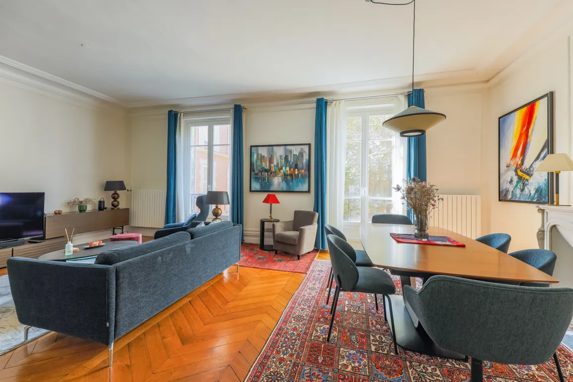 Spacious, bright luxury apartment. Elegant living-dining room with parquet, large windows & contemporary design. Perfect for a chic Parisian lifestyle.