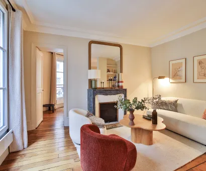 Luxury Parisian living room, modern and elegant design with fireplace, hardwood floor, natural light. Ideal for a high-end apartment.