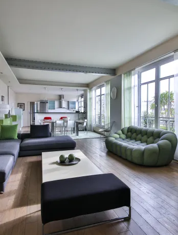 Spacious, bright luxury living room with contemporary design, open kitchen, and clear views. Perfect for a high-end apartment.